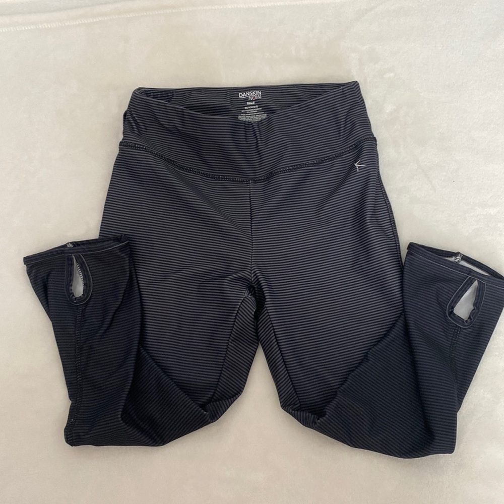 Dansko black and grey striped leggings. Cute detail of tear drop cutouts on legs